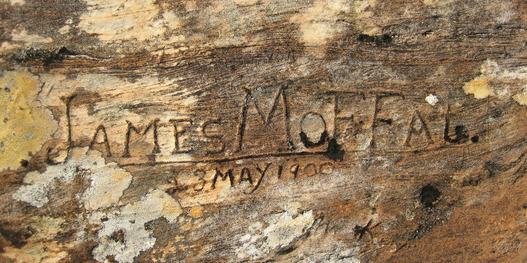 The works James Moffat 1900 carved into old wooden beam